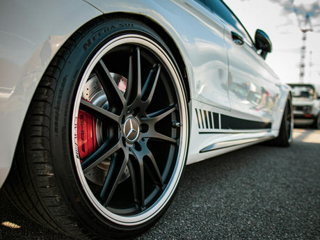 Photo by Aliaksei Semirski: https://www.pexels.com/photo/white-mercedes-benz-wheel-close-up-photo-13972881/