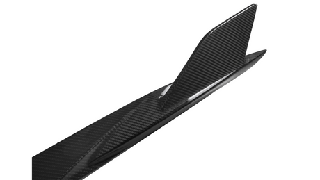 A carbon fiber surfboard featuring a sleek, curved fin is positioned against a plain white background, highlighting its modern and aerodynamic design.