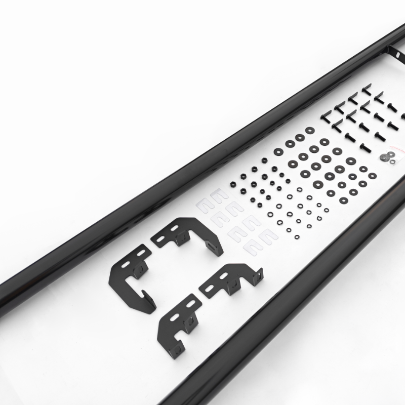 Black metal brackets and various screws are arranged neatly inside a black frame on a white surface, suggesting components for assembly, possibly for manufacturing or construction purposes.