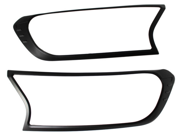 Two black plastic frames, resembling headlight covers, are positioned horizontally against a plain white background. Each frame has an asymmetric, modern design with smooth curves and sharp angles.