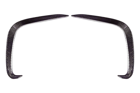 Two curved carbon fiber pieces form an arch-like shape, positioned symmetrically on a white background. They appear sleek and aerodynamically designed.