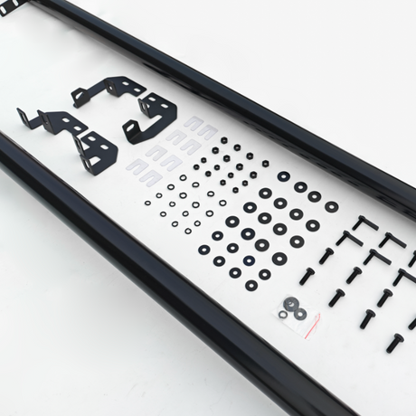 Assorted black metal brackets, screws, and washers are neatly arranged on a white surface, with two long black rails framing the top and bottom.