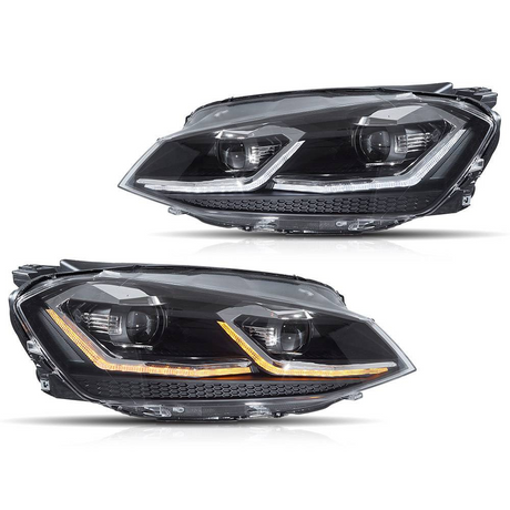 Two sleek car headlights are shown with LED accents; one displays white and the other orange lights. They are placed against a plain white background.