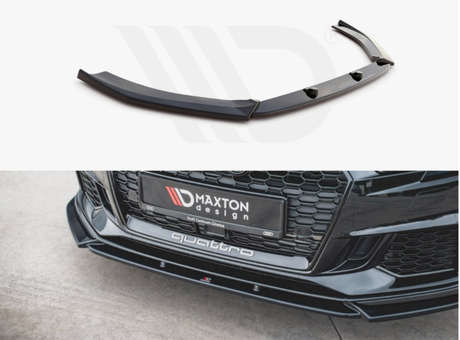 A black car front splitter with mounting holes is shown above a car bumper. Text on the bumper reads "MAXTON design" and "quattro," with a honeycomb grille above it on a concrete surface.
