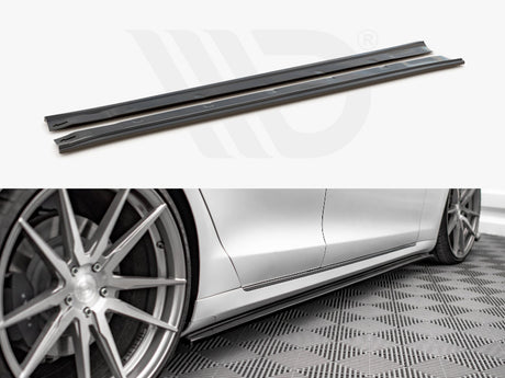 Two black side skirt extensions shown in detail above a photo of a silver car with them installed, positioned next to stylish alloy wheels on a patterned floor.