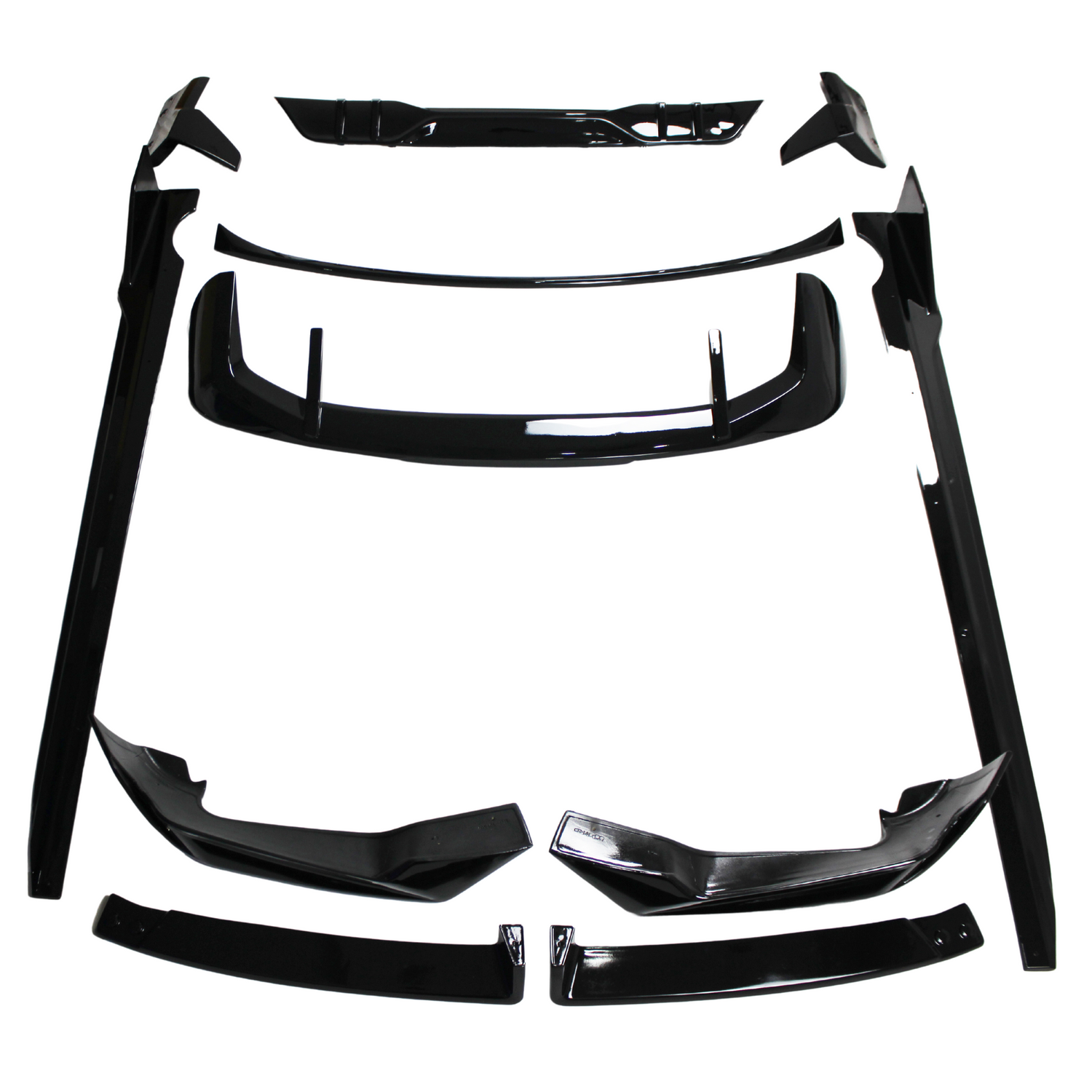 Black car body kit components, including spoilers and side skirts, are arranged on a white background. The parts are neatly organized, showcasing their glossy finish and aerodynamic design.