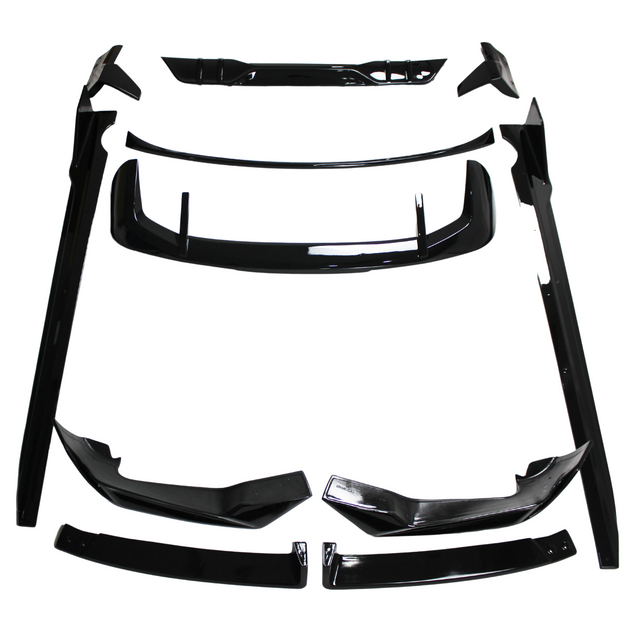 Black car body kit components, including spoilers and side skirts, are arranged on a white background. The parts are neatly organized, showcasing their glossy finish and aerodynamic design.