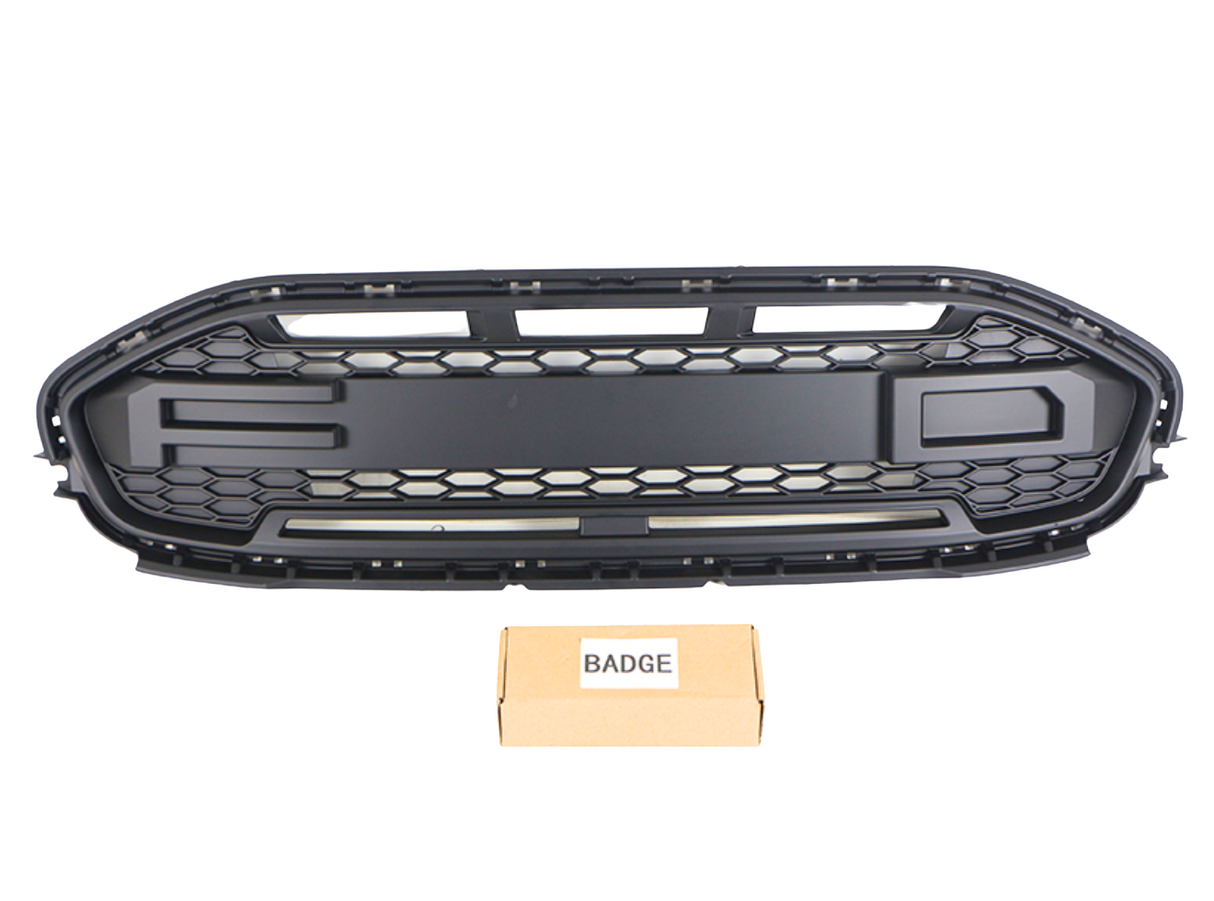 A black car grille with a honeycomb pattern lies above a cardboard box labeled "BADGE," against a plain white background.