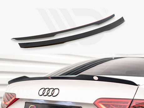 Two black car spoilers, one installed on the rear trunk of a white car with visible Audi logo, set in a well-lit parking environment.