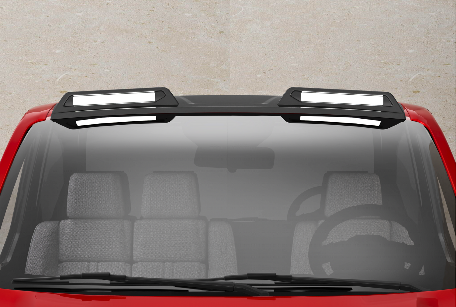 A red vehicle with a black roof features two rectangular, white-highlighted roof racks. The front windshield shows a steering wheel and gray seats inside the car, against a concrete background.