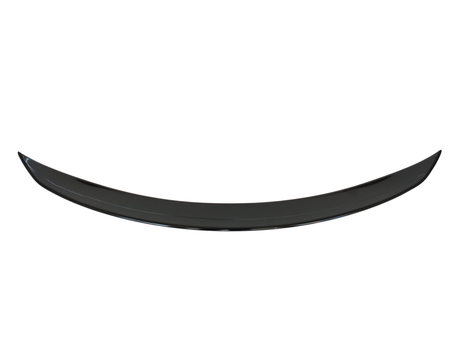 A black, crescent-shaped object curves upward, possibly a car spoiler, set against a plain white background.