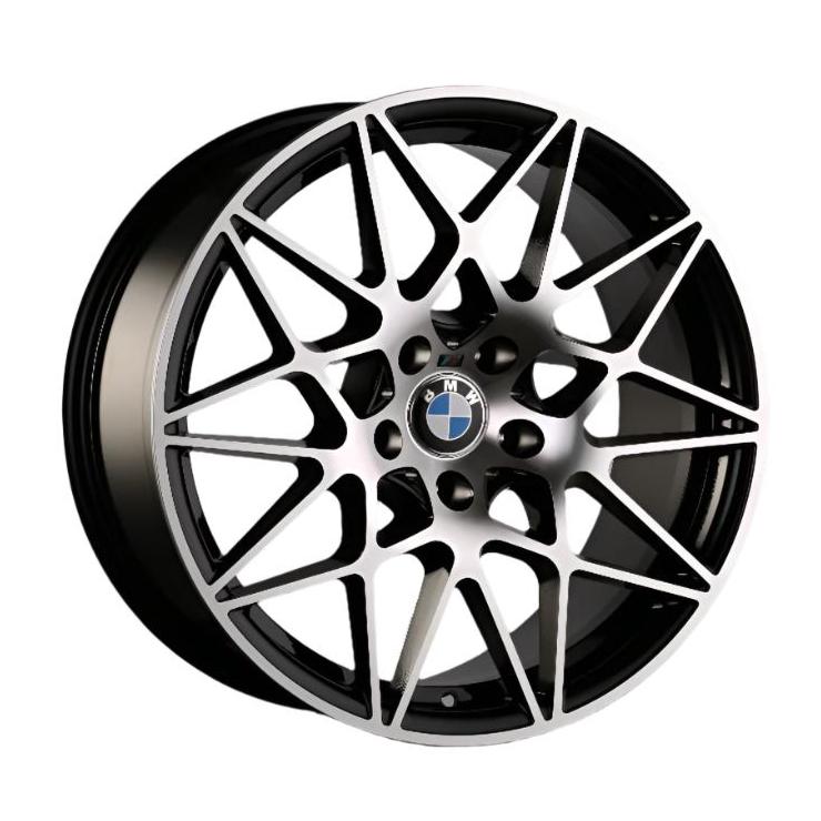 A multi-spoke alloy wheel with geometric patterns features the BMW logo at the center. It has a metallic finish and is designed for automotive use.