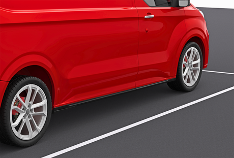 A red van is parked in a parking space, with visible white lines on the asphalt. The focus is on the side and wheels, highlighting its sleek design and shiny finish.