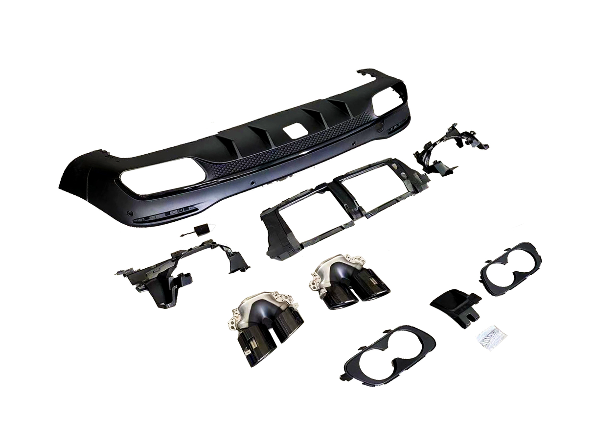 Car bumper parts and accessories are arranged on a plain white background, including a black bumper, exhaust tips, and mounting brackets, suggesting a display of automotive components.