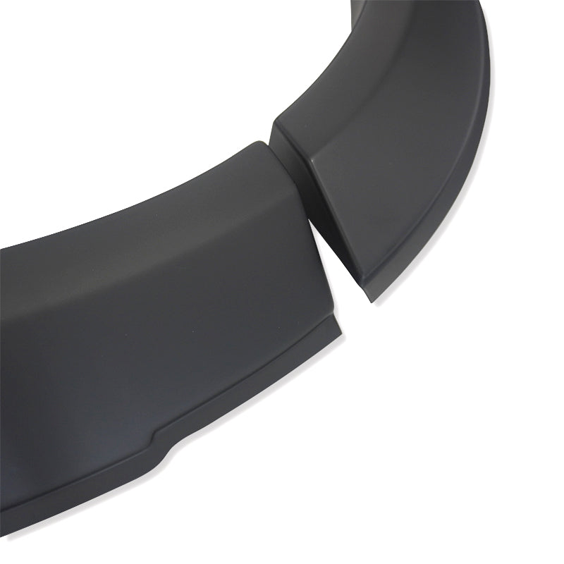 Curved black plastic pieces are arranged on a white background, showing a perspective of overlapping separated components.
