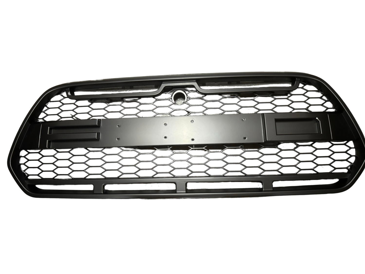 A black car grille with a hexagonal mesh pattern, designed to cover the front section of a vehicle, is shown on a plain white background.