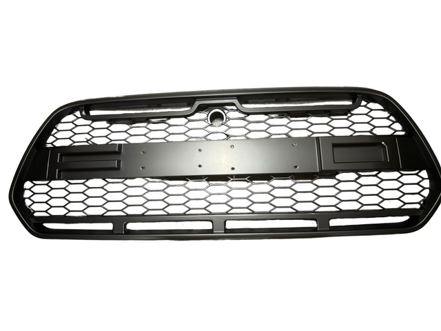 A black car grille with a hexagonal mesh pattern, designed to cover the front section of a vehicle, is shown on a plain white background.
