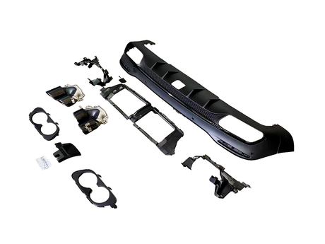 Auto body kit components are arranged on a white surface, including a bumper and grille sections, headlight housings, and various brackets, providing parts for vehicle modification and repair.