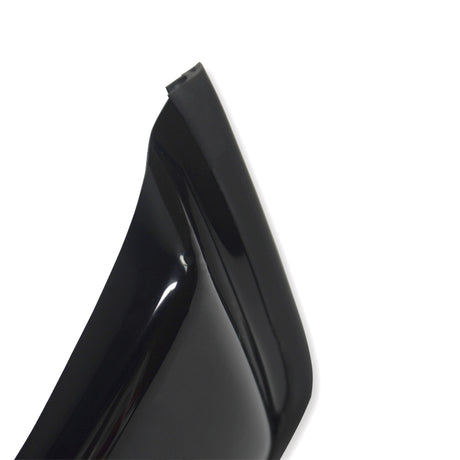 A glossy black high-heeled shoe with a sharp heel edge is positioned against a plain white background. The focus is on the rear and top section of the heel.