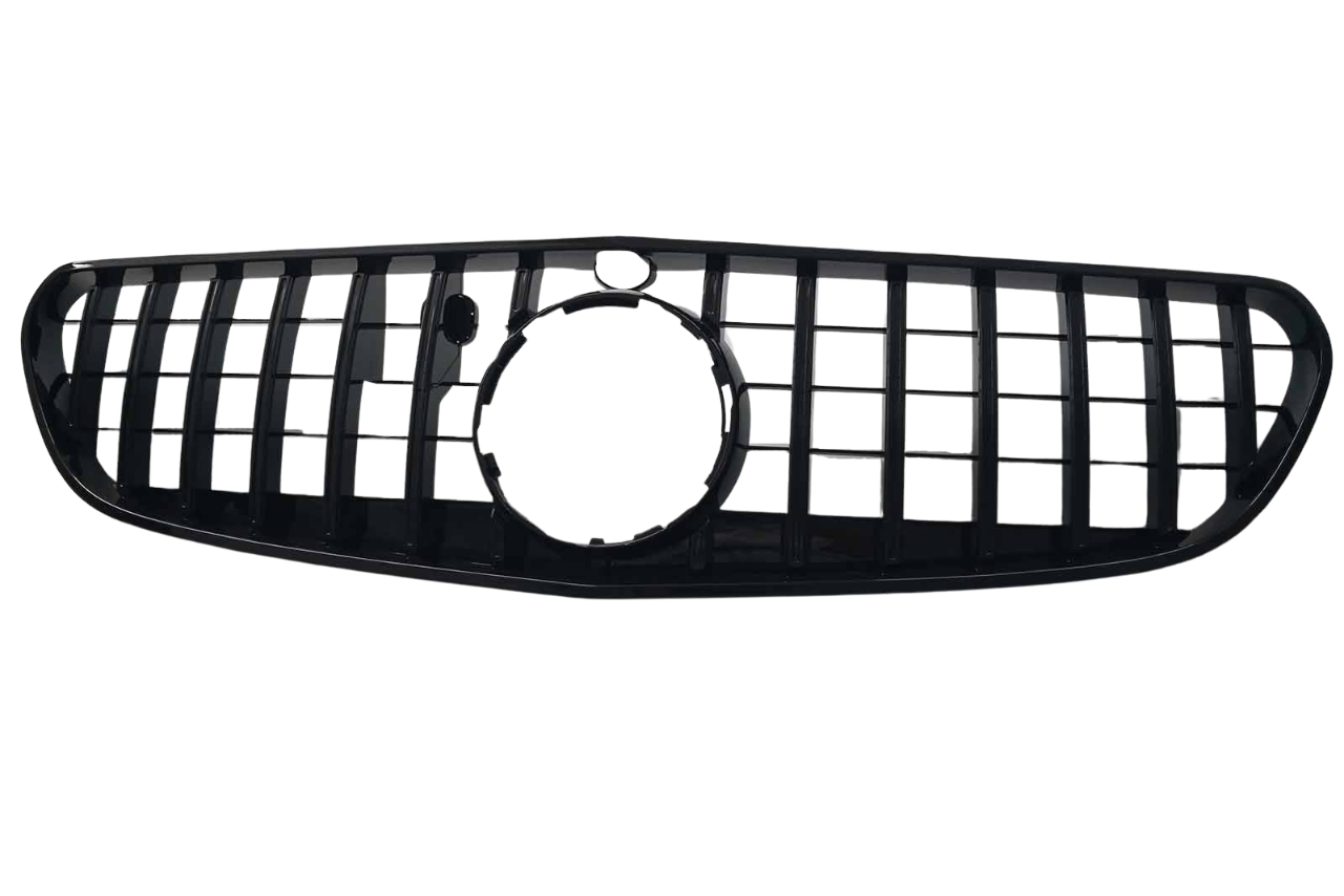 A black car grille features vertical and horizontal slats forming a rectangular pattern, with a circular opening in the center, set against a plain white background.