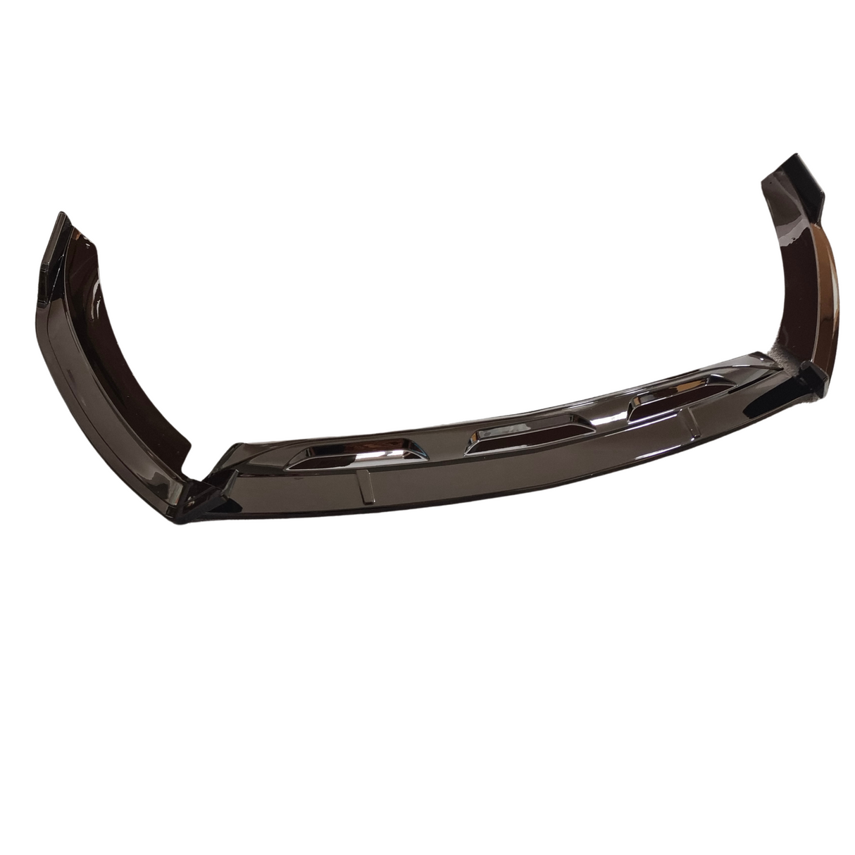 A glossy black car bumper, featuring aerodynamic contours and vent-like cutouts, rests on a plain white background.