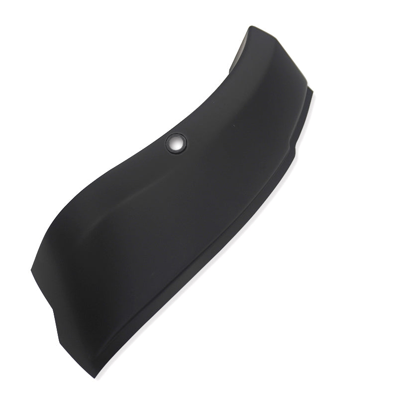 Curved black object with a smooth surface and a circular indentation, possibly a mounting hole, set against a plain white background.
