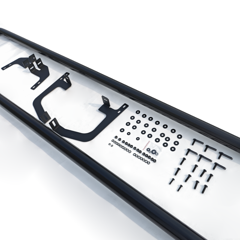 Various black metal brackets and screws arranged neatly on a white surface. Two long black rails frame the array, creating an organized presentation of hardware components.