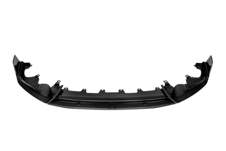 Curved black carbon fiber car bumper with mounting brackets, positioned horizontally against a plain white background, displaying a sleek design and intricate texture.
