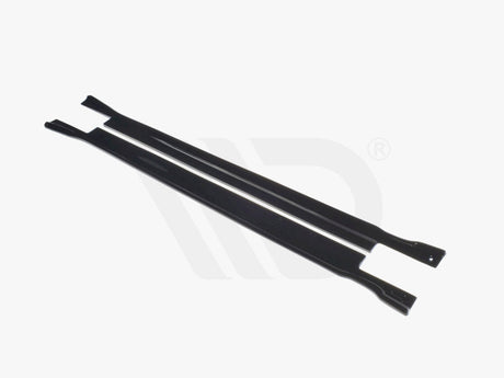 Two sleek, black aerodynamic components lie parallel to each other against a white background. Text at the bottom reads: "WORLDWIDE LEADER IN AERODYNAMIC COMPONENTS."