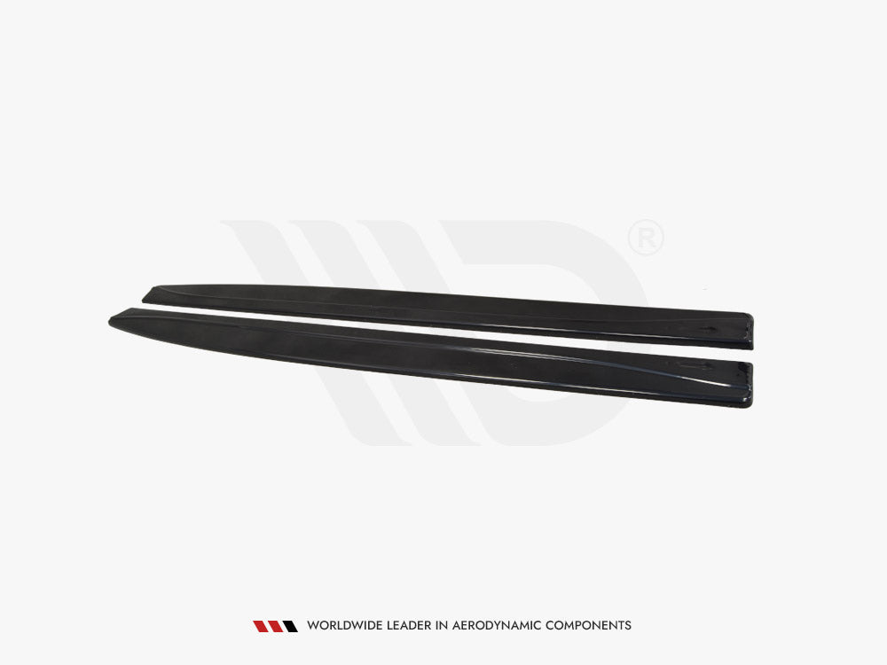 Two black, elongated aerodynamic car components lie parallel on a plain white background. Text reads: "WORLDWIDE LEADER IN AERODYNAMIC COMPONENTS."