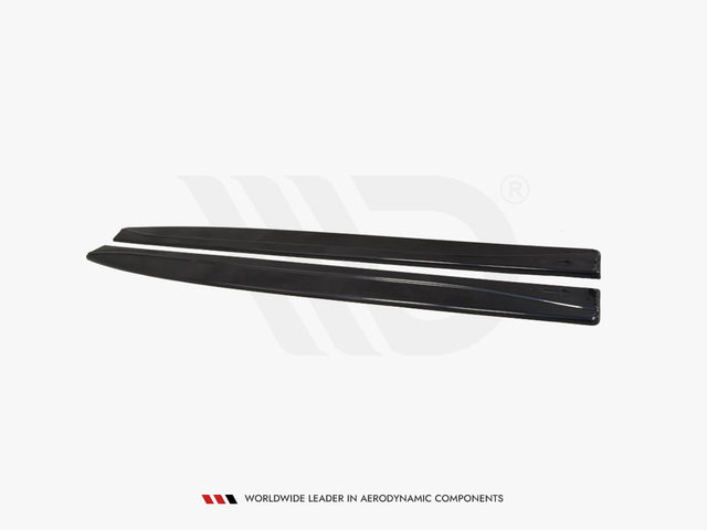 Two black, elongated aerodynamic car components lie parallel on a plain white background. Text reads: "WORLDWIDE LEADER IN AERODYNAMIC COMPONENTS."