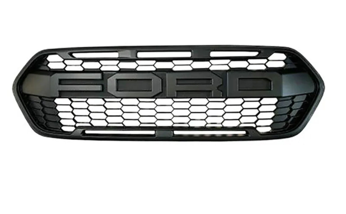 A black car grille features the text "FORD" in large letters against a hexagonal mesh pattern, set against a plain white background.