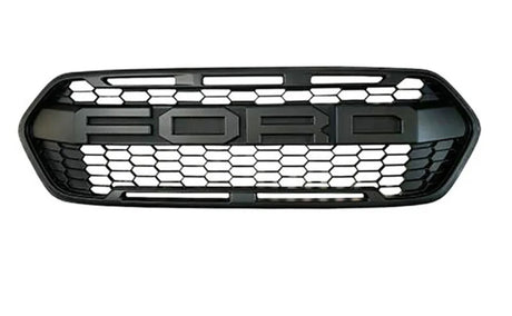 A black car grille features the text "FORD" in large letters against a hexagonal mesh pattern, set against a plain white background.
