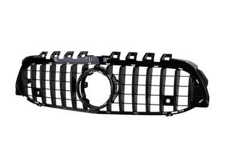 A black car grille with vertical slats, featuring a prominent circular emblem space in the center, isolated against a white background.