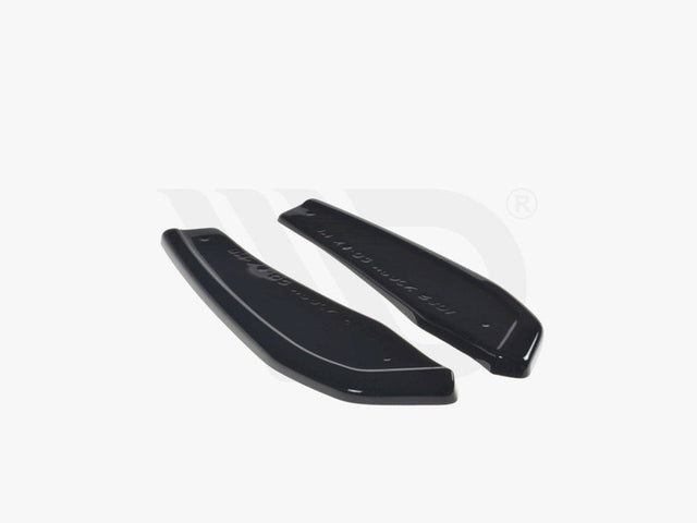 Two sleek black aerodynamic components rest on a plain white background. Text reads: "WORLDWIDE LEADER IN AERODYNAMIC COMPONENTS."