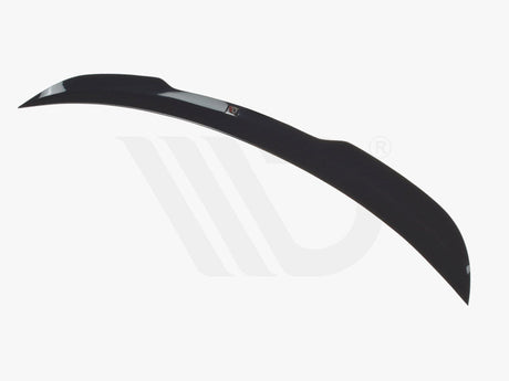 A sleek, black car spoiler curves elegantly against a white background, highlighting its aerodynamic design. Below, text reads "WORLDWIDE LEADER IN AERODYNAMIC COMPONENTS."