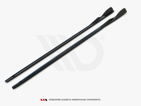 Two elongated, sleek black components lie parallel on a white surface. They have a contoured design for aerodynamics. Text below reads, "WORLDWIDE LEADER IN AERODYNAMIC COMPONENTS."