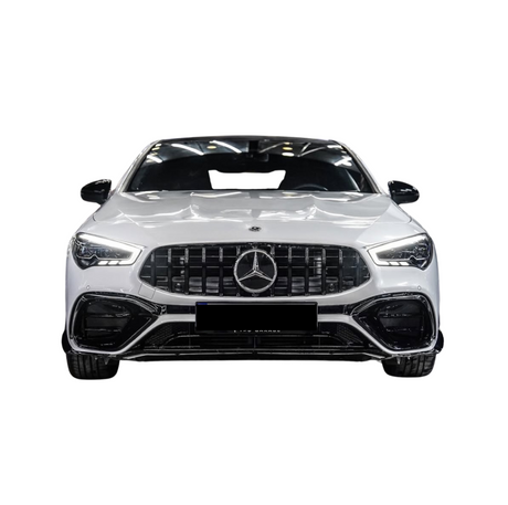 A white Mercedes-Benz car is displayed from the front, showcasing a prominent grille, sleek headlights, and a glossy finish in an isolated setting.