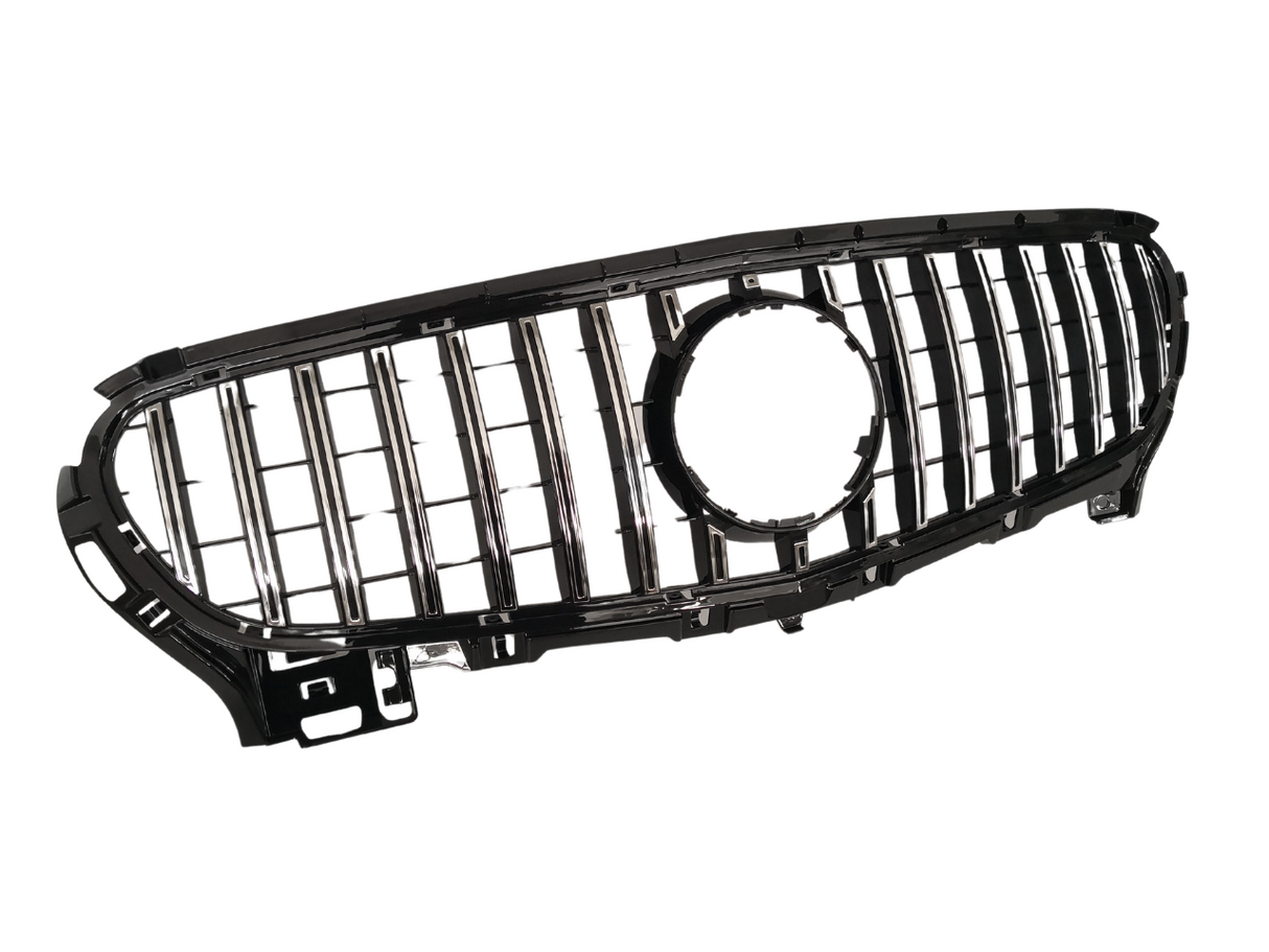 A black and chrome car grille with vertical slats and a central circular opening, positioned against a plain white background.