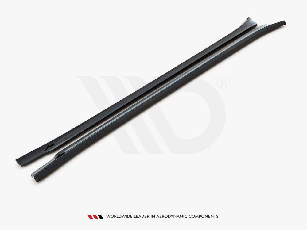 Two elongated, black aerodynamic bars lay side by side on a white surface. Text reads: "WORLDWIDE LEADER IN AERODYNAMIC COMPONENTS" at the bottom.