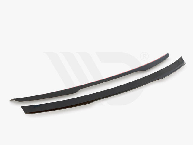 Two sleek black aerodynamic components are displayed on a white background. They are thin, elongated, and slightly curved. Text below reads, "WORLDWIDE LEADER IN AERODYNAMIC COMPONENTS."