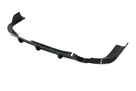 A sleek, black car bumper lip spoiler rests against a white background. It features aerodynamic curves and angled ends, designed to enhance vehicle aesthetics and performance.