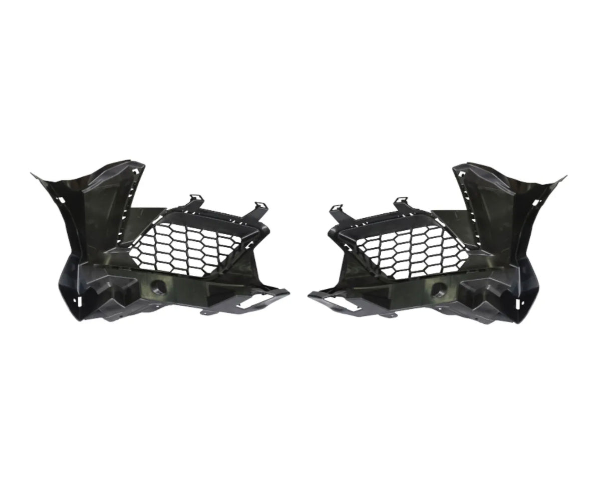 Two black plastic car components with honeycomb cutouts are symmetrically positioned. They have angular designs, suggesting automotive parts, likely for ventilation or structural support. Plain white background.
