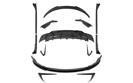 Carbon fiber car body kit parts, precisely arranged, suggesting assembly. Components include a diffuser, spoilers, side skirts, and splitters, placed on a plain white background.