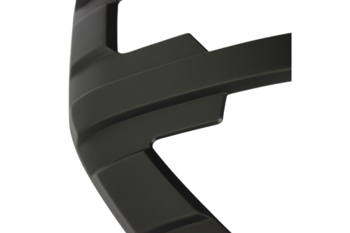 A curved black object with ridges; likely part of a larger structure or machinery component, viewed against a plain white background.