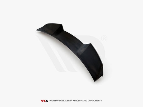 A black car spoiler, featuring aerodynamic contours, sits isolated on a white background. Text below reads: "Worldwide Leader in Aerodynamic Components."