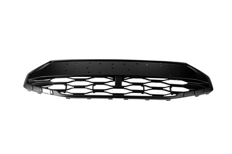 A black car grille with a honeycomb pattern lies stationary against a white background, featuring multiple small holes along the top edge.