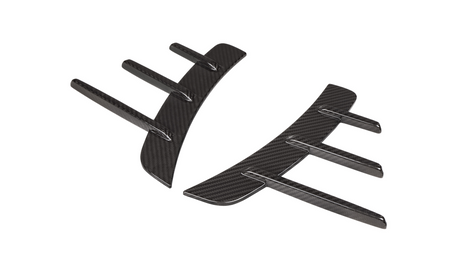 Black carbon fiber fin-like appendages curve inward, resembling aerodynamic car accessories, set against a white background.