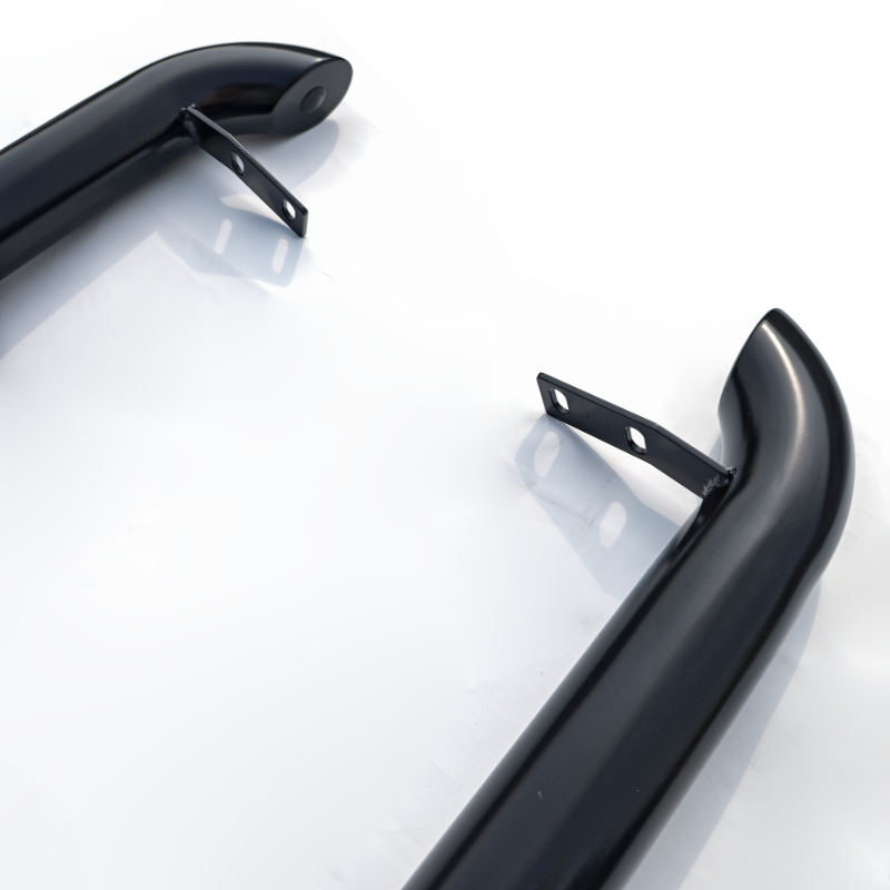 Two black, curved metal bars with mounting brackets are positioned on a white surface, appearing ready for installation or attachment in an industrial or automotive context.