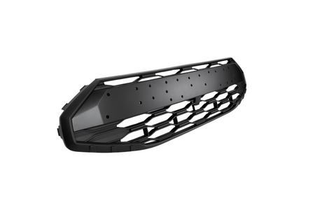 A black, hexagonal-patterned automotive grille is displayed against a white background, showcasing its sleek, angular design with detailing and bolt holes.